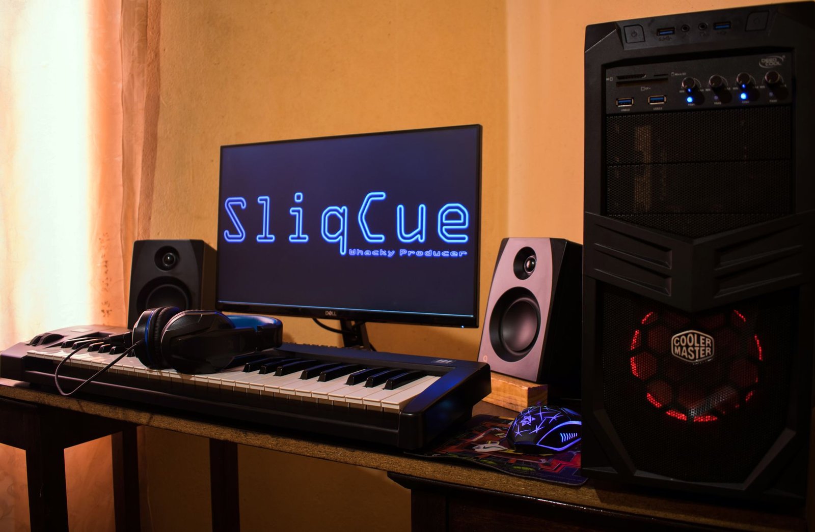 Producer working at a music production workstation with audio software
