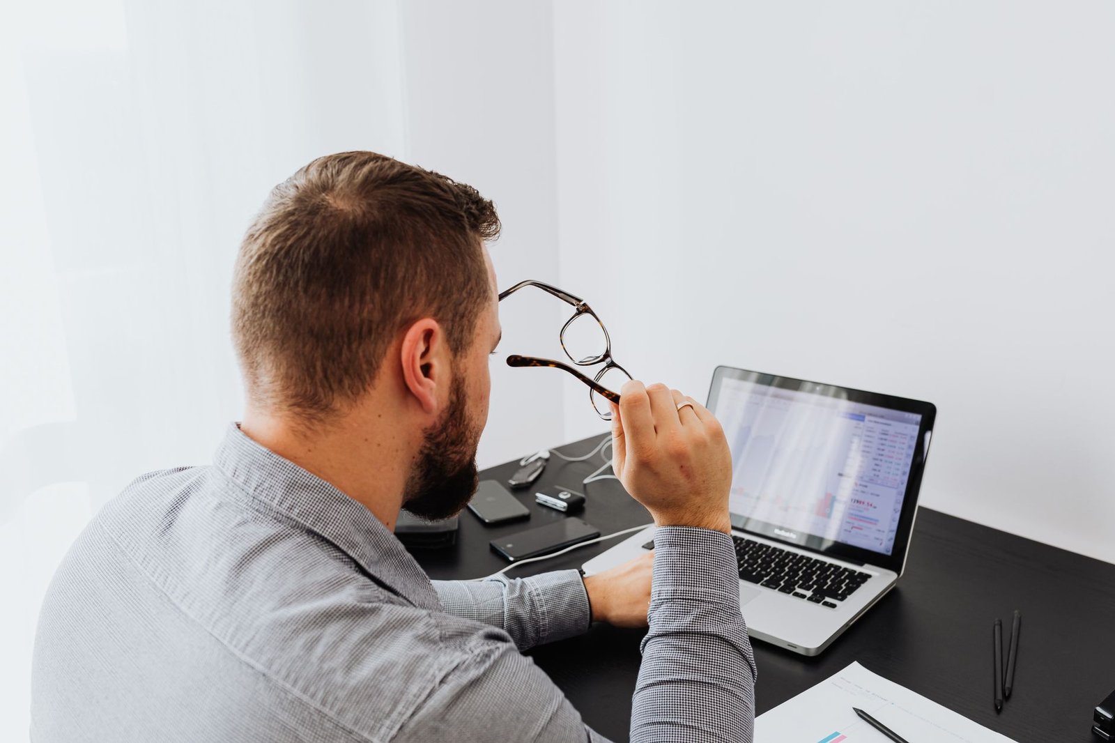 Professional working at a laptop using voice dictation software