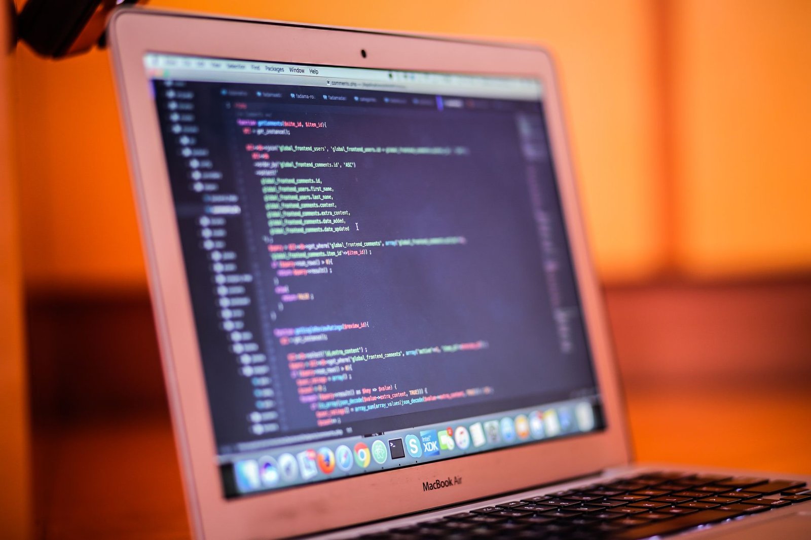 Laptop showing a code editor, representing Cursor AI autocomplete and Composer workflow