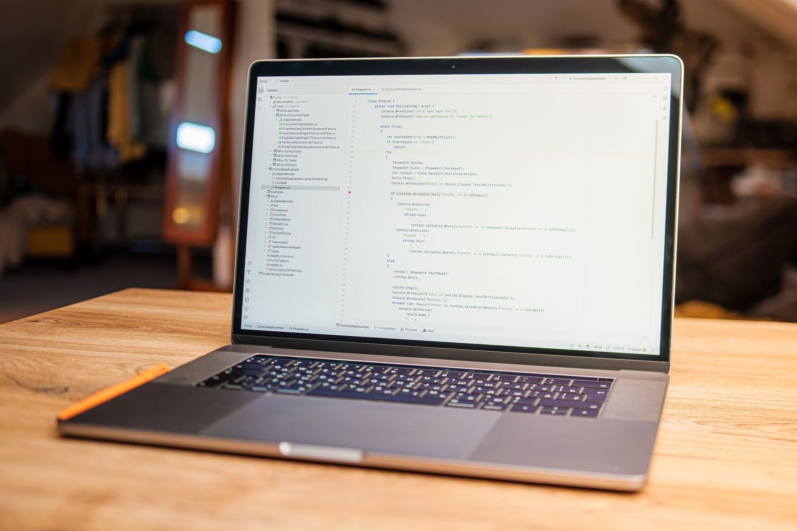 A developer workspace with a laptop where an AI coding editor would run