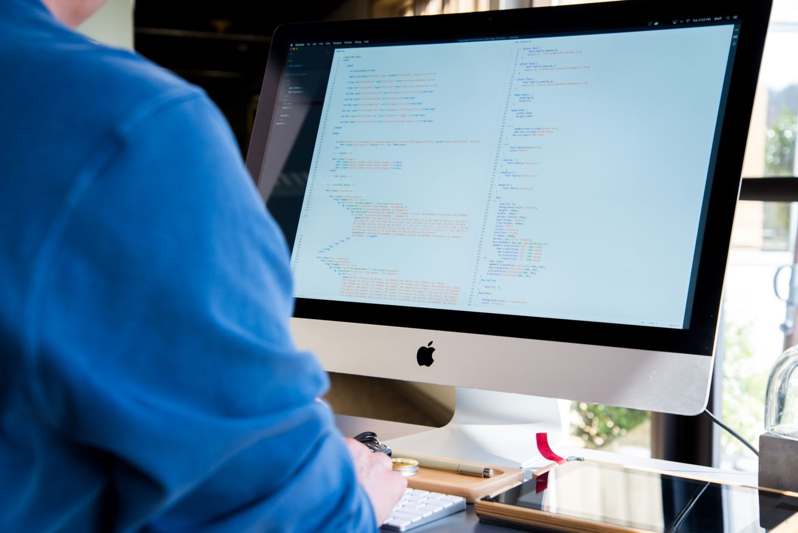 Junior developer coding at a laptop that Devin AI aims to assist or replace