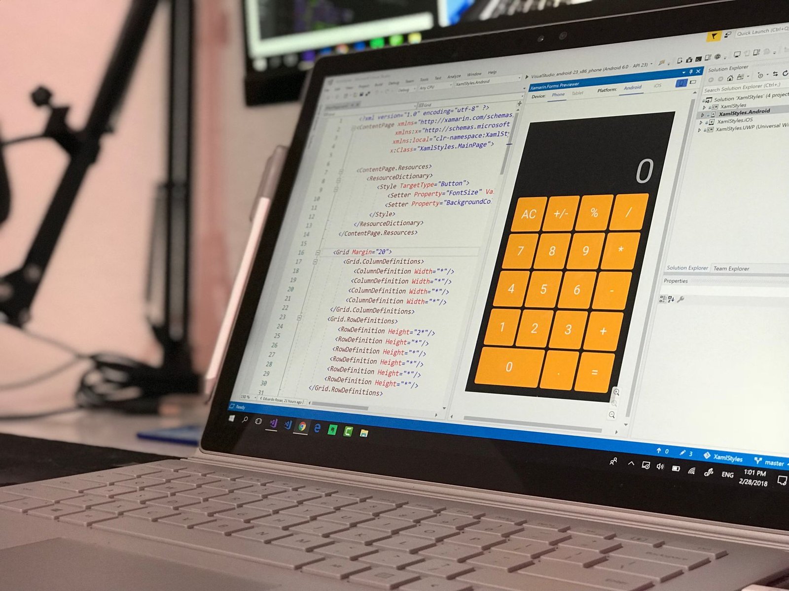Laptop showing a coding application interface, representing an AI-built app from a text prompt