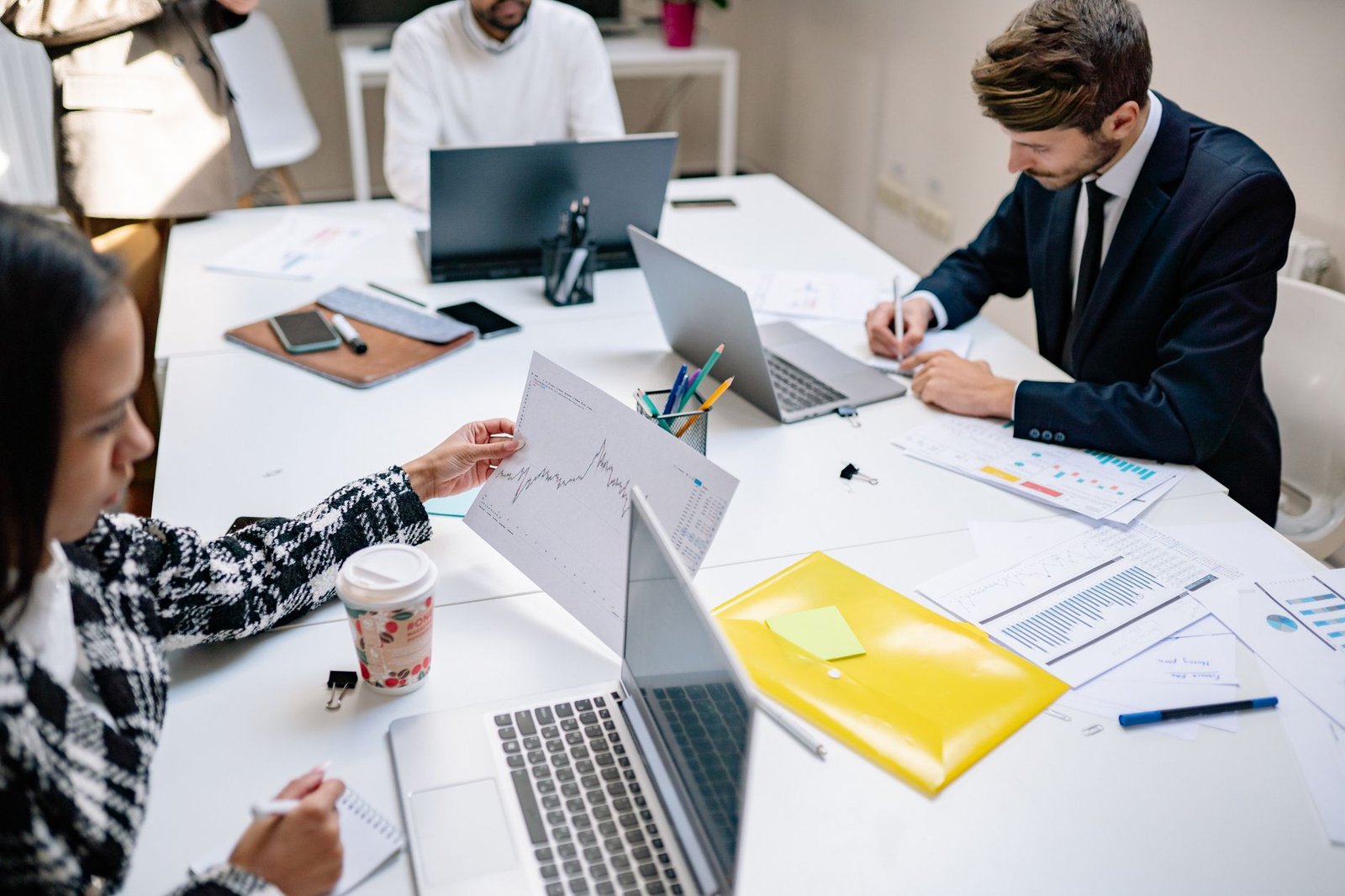 A marketing team collaborating in an office, the multi-seat use case Jasper AI targets
