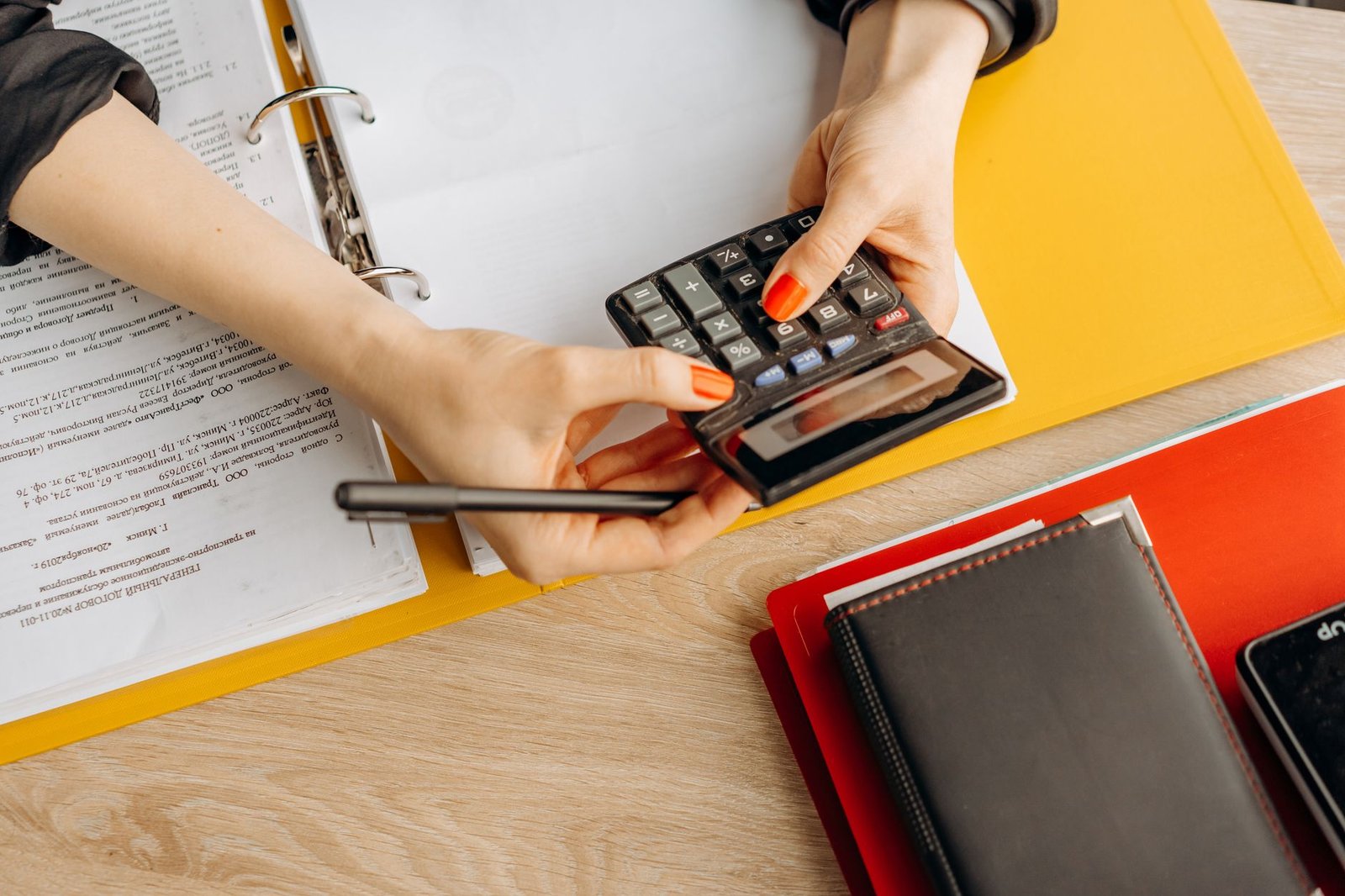 Bookkeeping and accounting work with calculator and financial documents