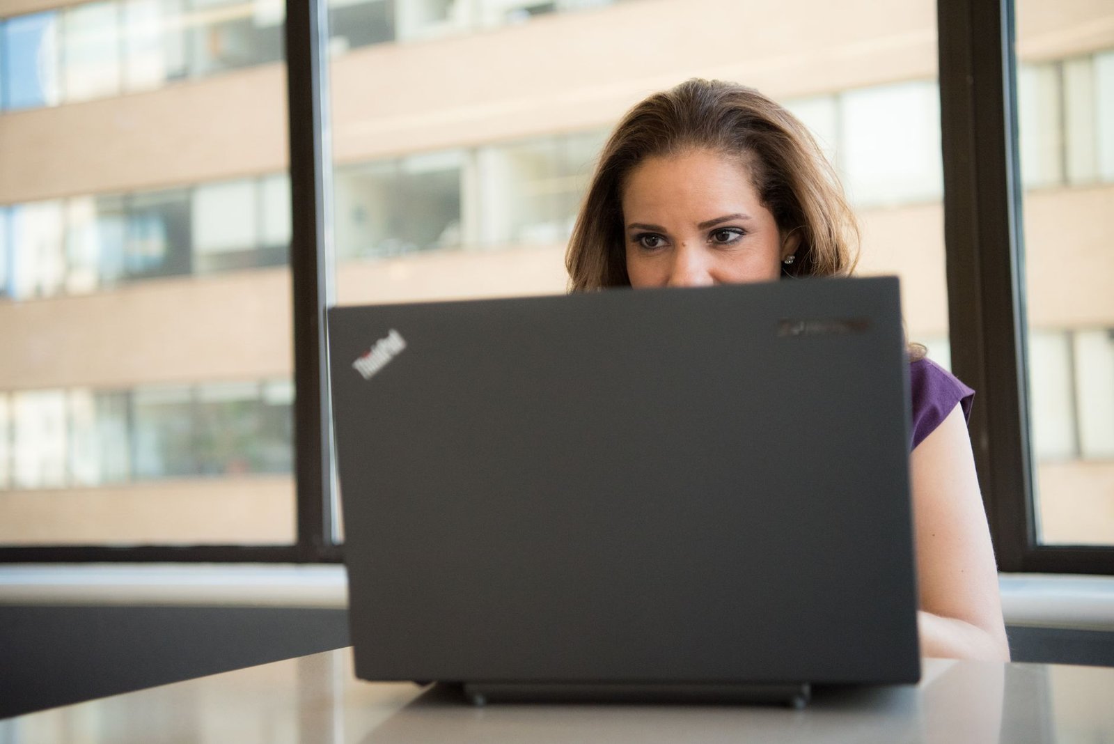 Real estate agent using AI software on a laptop