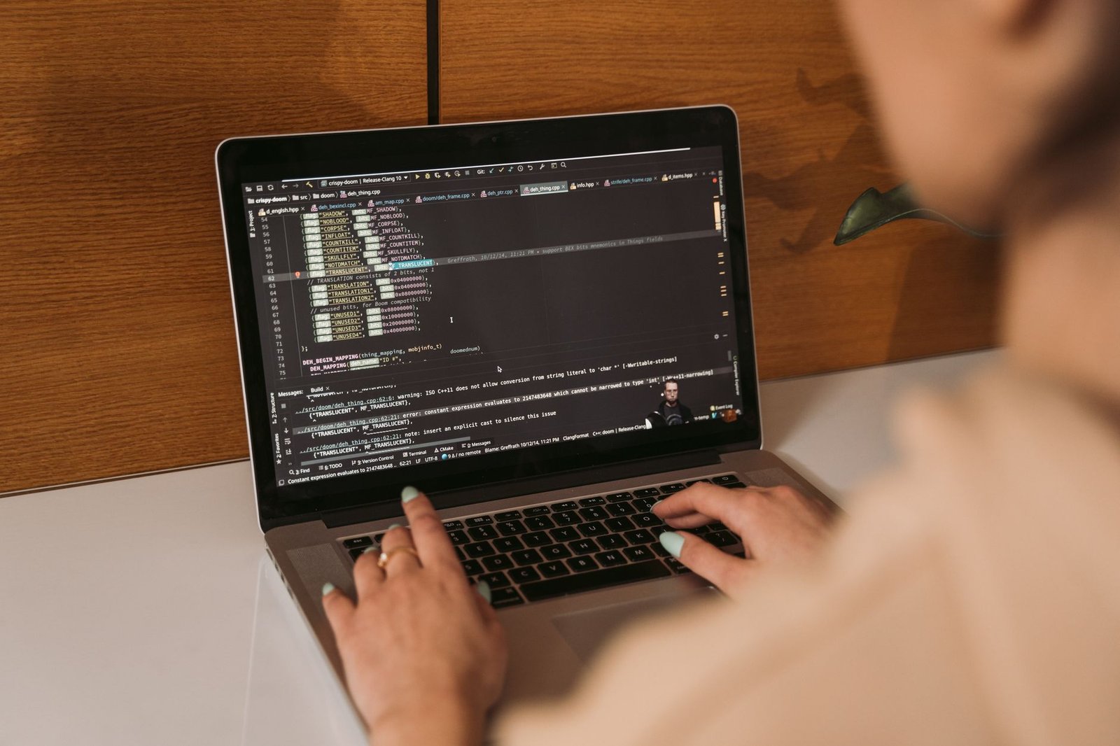Developer reviewing code generated by Replit AI Agent on screen