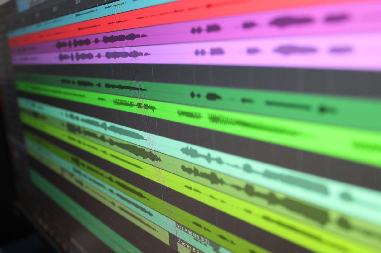 Audio waveforms on a screen representing speech-to-text accuracy testing
